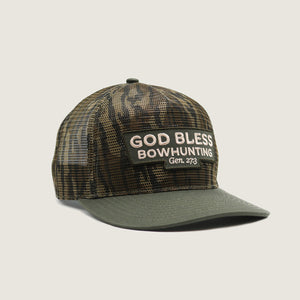 Camouflage cap with 'God Bless Bowhunting' text on a light gray background